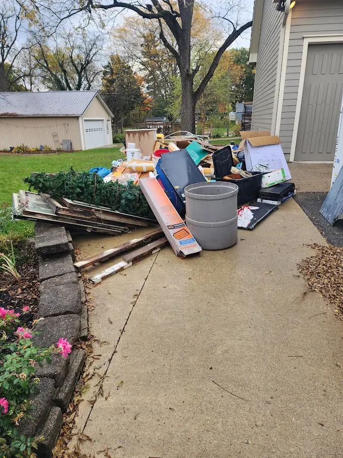 Dumpster being loaded with debris for Residential Dumpster Rental in Commerce City